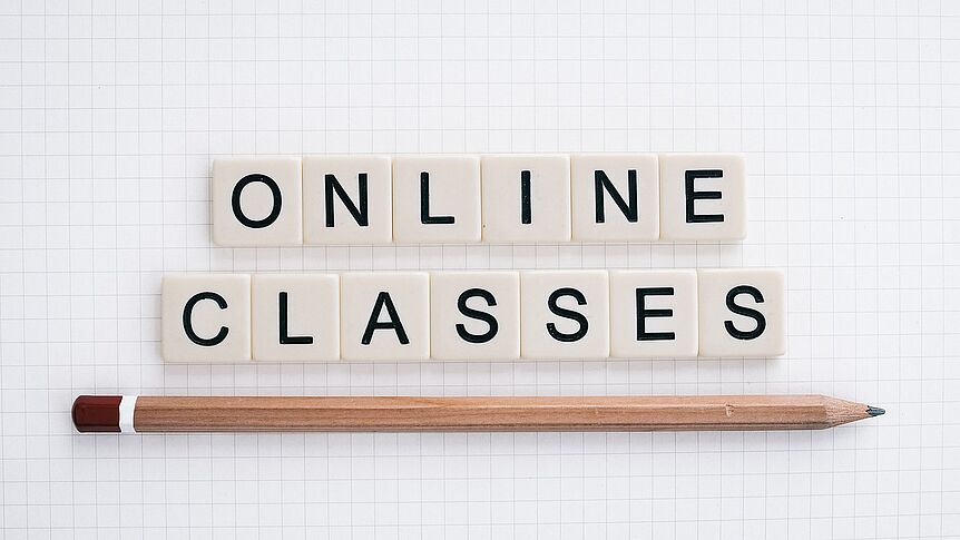 decorative image with lettering saying "online classes"